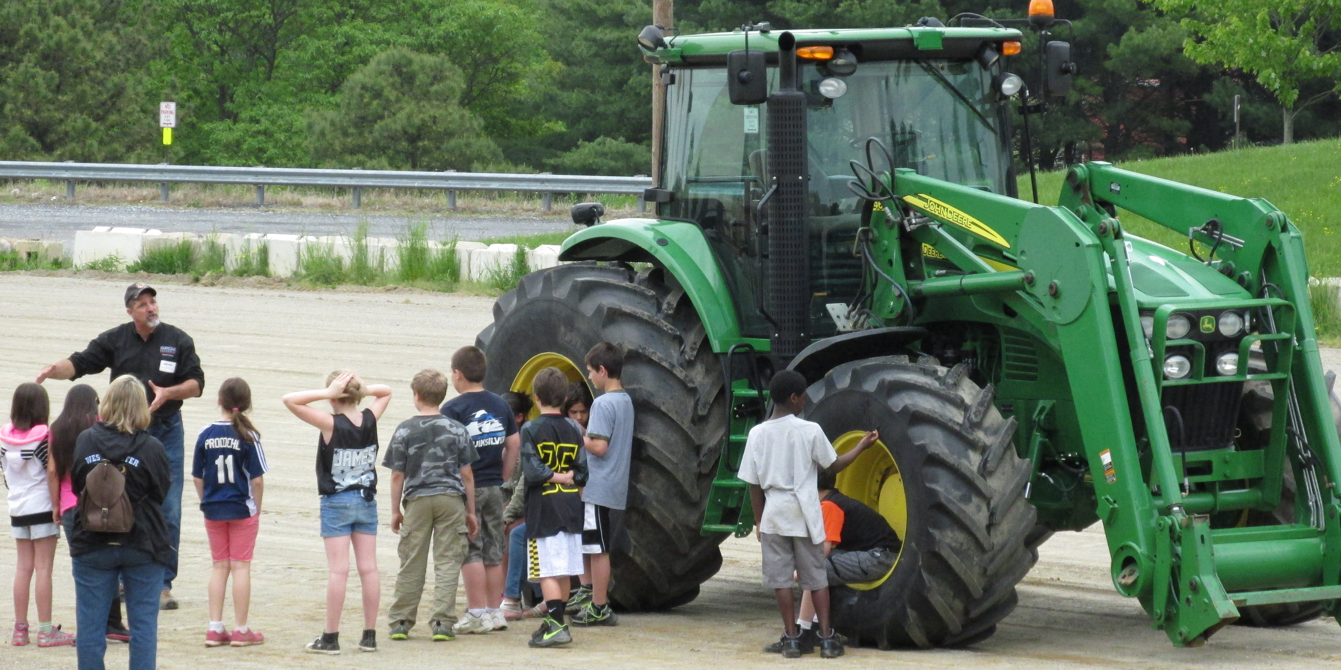 Children learn about and interact with large farm equipment